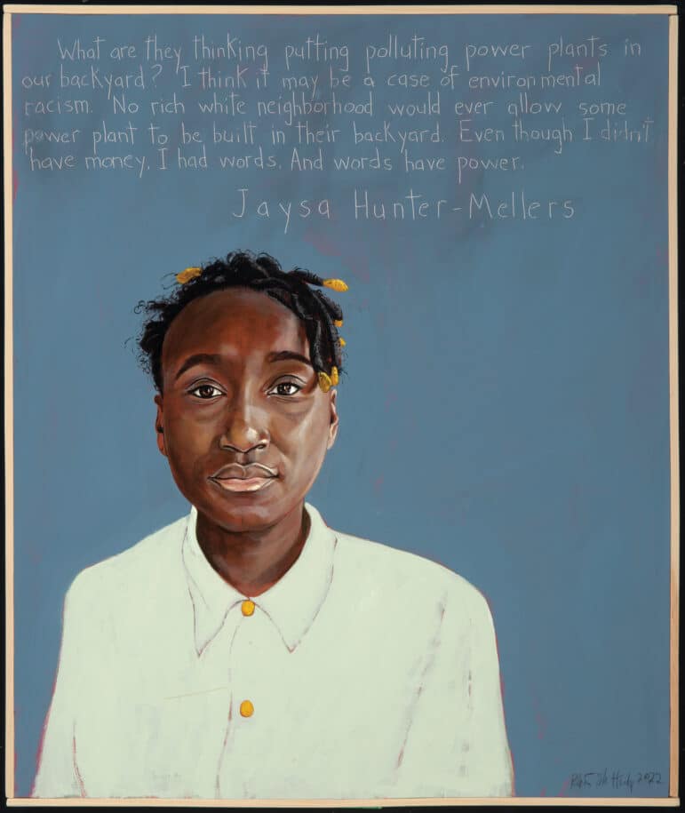A portrait of Jaysa Huter Mellers, a younger Black girl. She has a short protective hairstyle with yellow/gold accessories. She wears a white button down shirt with gold buttons, and her background is blue. 