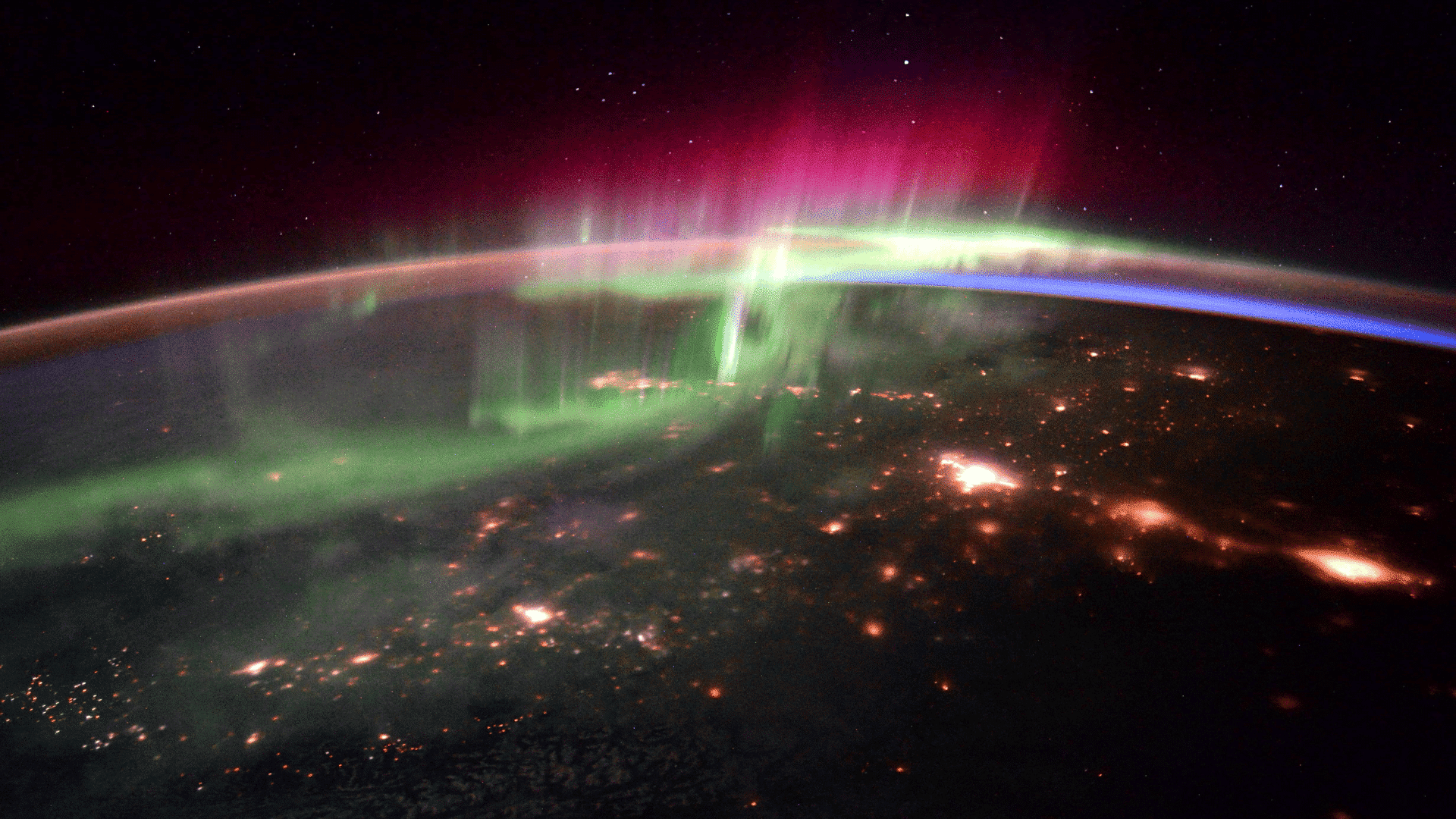 Interplay between the atmosphere and aurora over the Pacific Northwest captured from the ISS