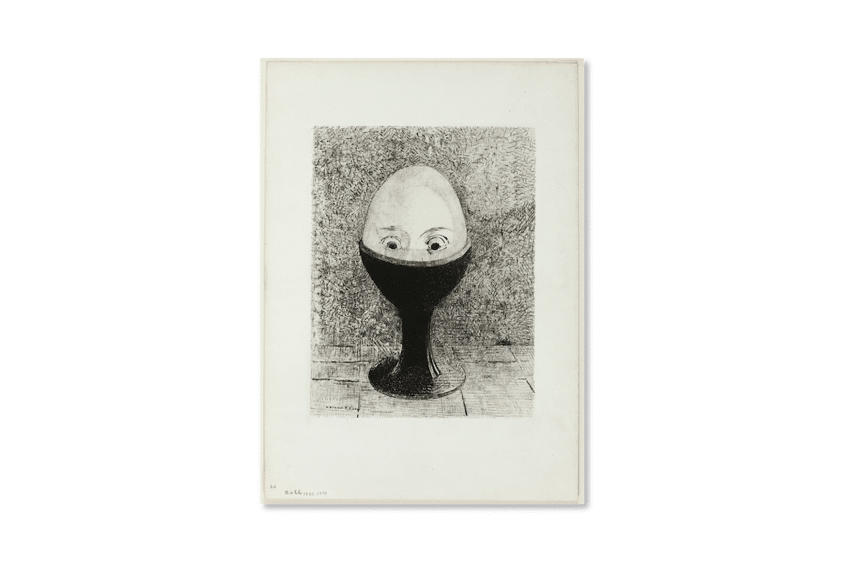 A black and white lithograph of an egg head with eyes half emerging from a black stand. Odilon Redon, The Egg, 1885. Lithograph in black on ivory china paper laid down on ivory wove paper, 17.25 × 12.36 inches (sheet), art institute chicago